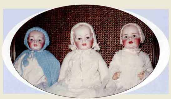 Three secured dolls