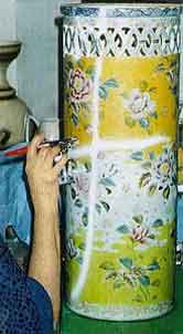 Large umbrella stand vase with work in process ceramic repair airbrush work